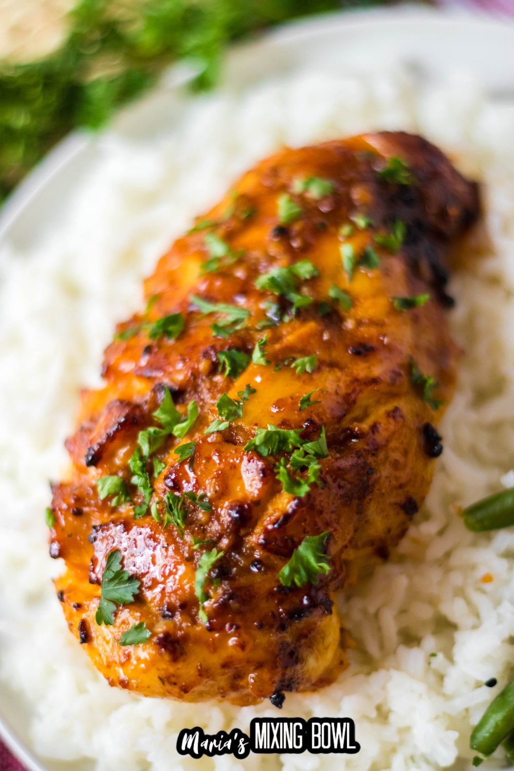 air fryer hot honey chicken breast on top of a bed of rice