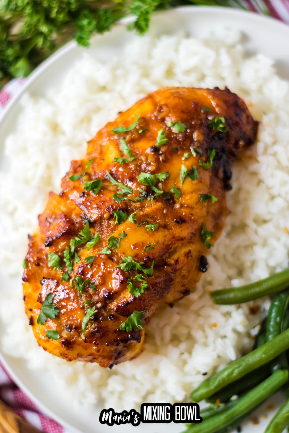air fryer hot honey chicken breast on top of a bed of rice