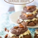 almond joy cookies on a white plate and teal and white napkin