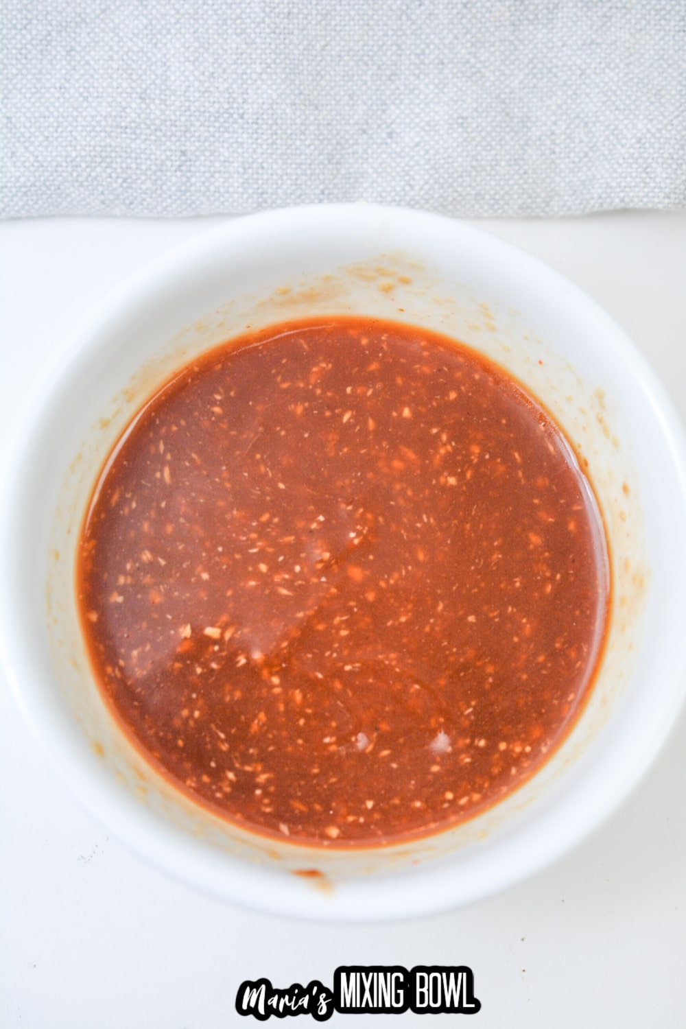 soy sauce glaze in a small white bowl