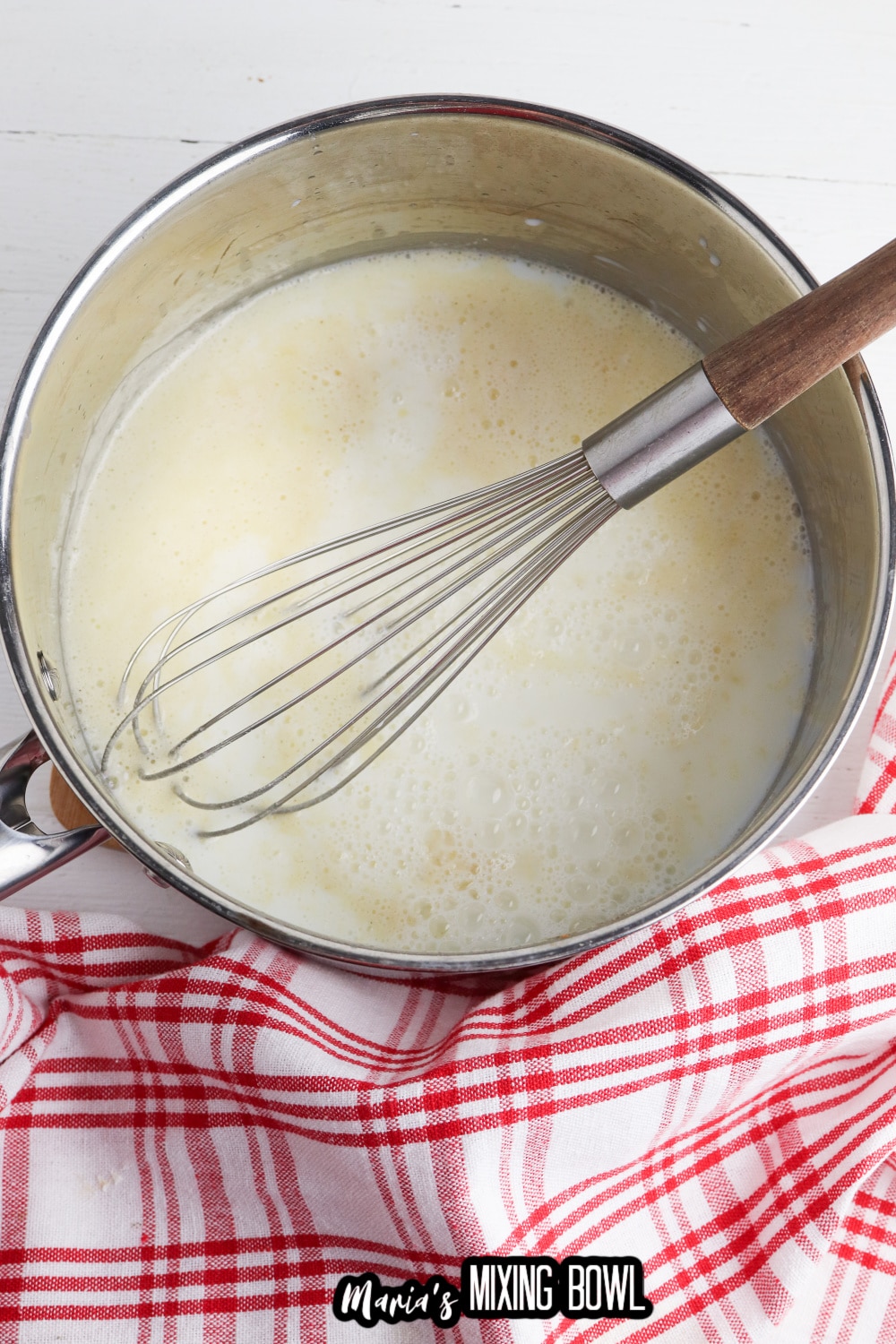 gravy in a saucepan with a whisk