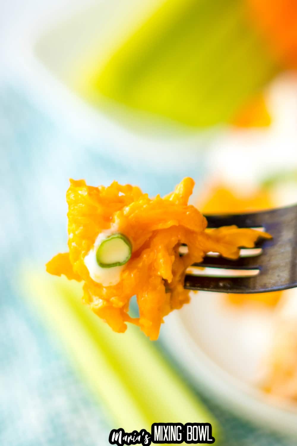 bite of buffalo chicken stuffed shells on a fork