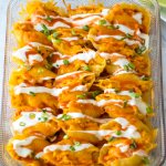 buffalo stuffed shells in a glass baking dish