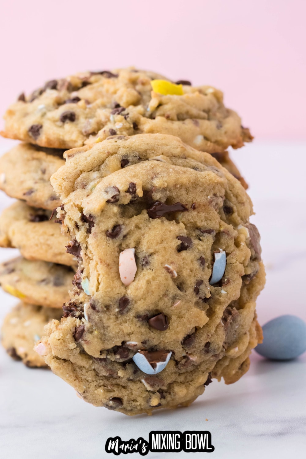stack of cadbury chocolate chip cookies on a white background