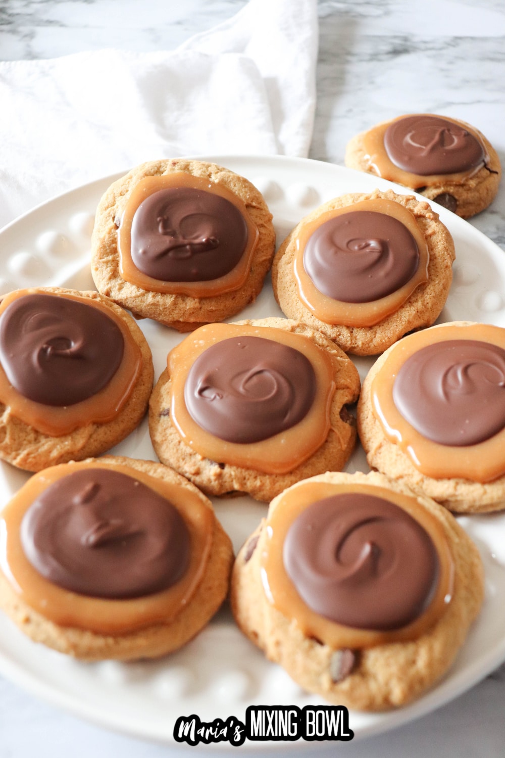 chocolate caramel cookies on a white plate