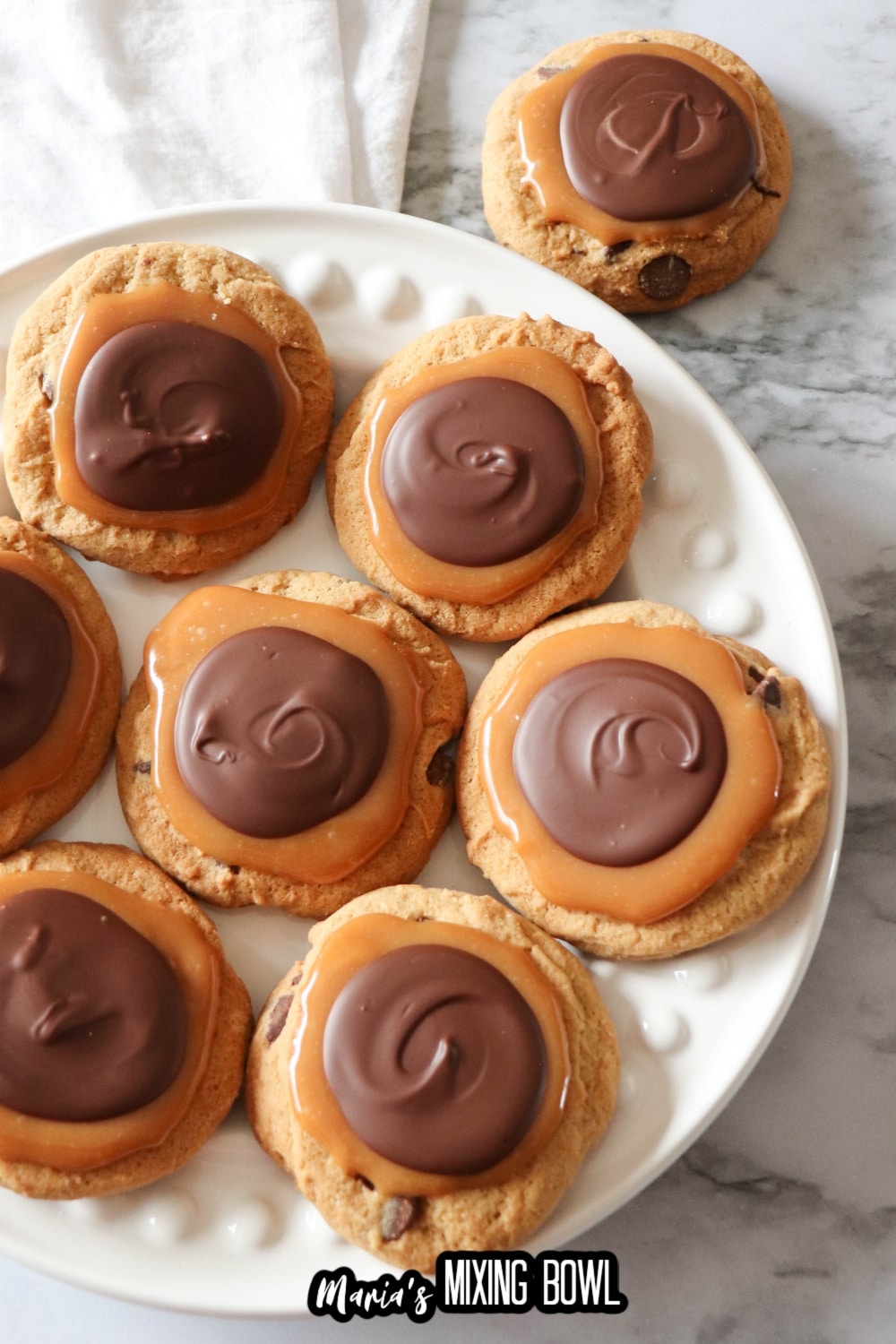 chocolate caramel cookies on a white plate