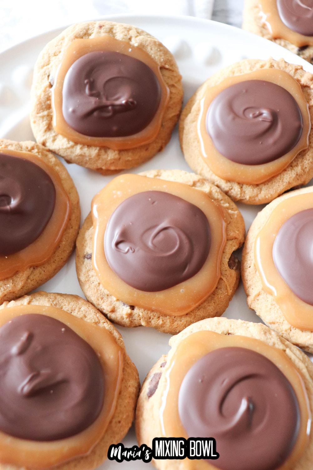chocolate caramel cookies on a white plate