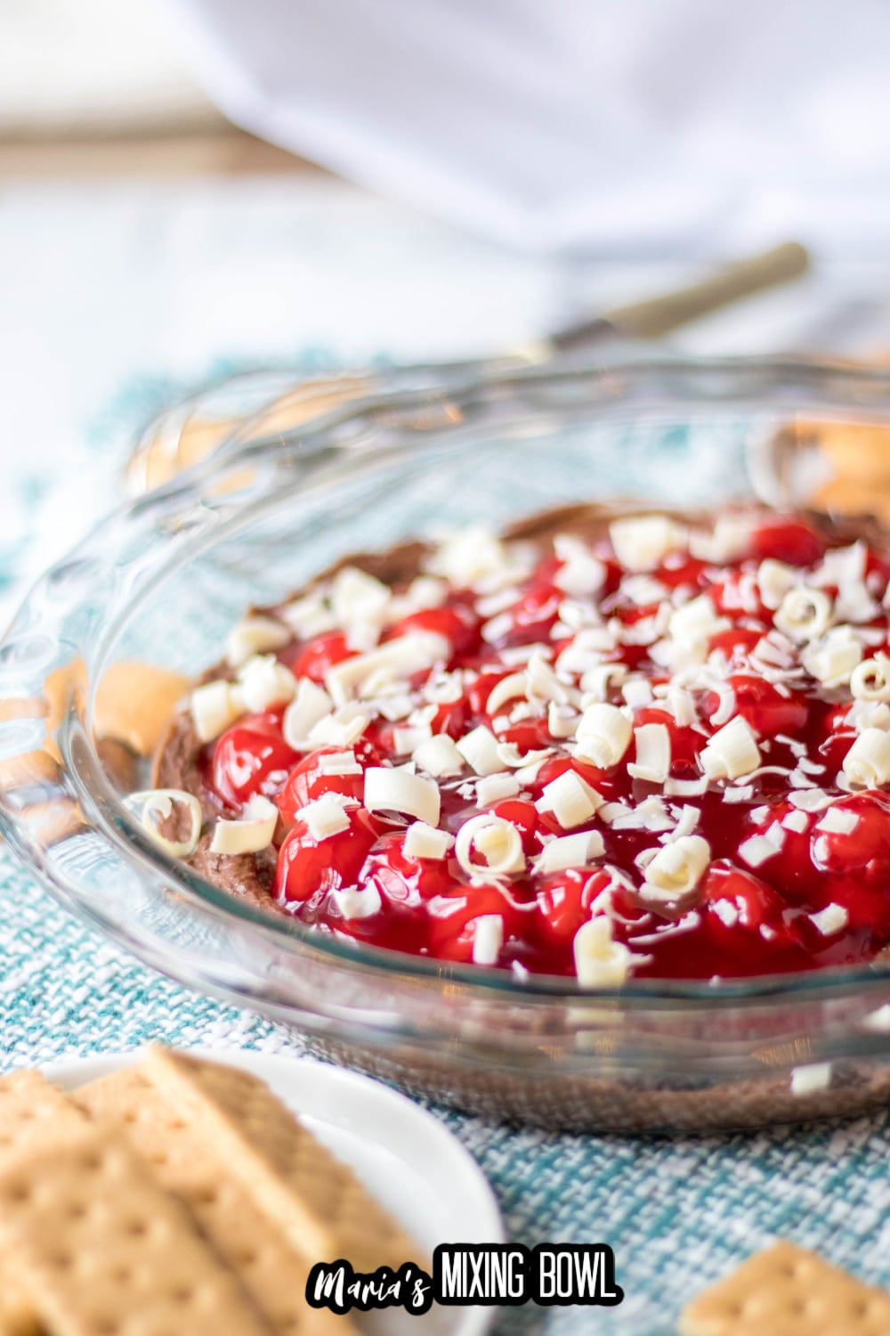 chocolate cheesecake dip with cherries on top
