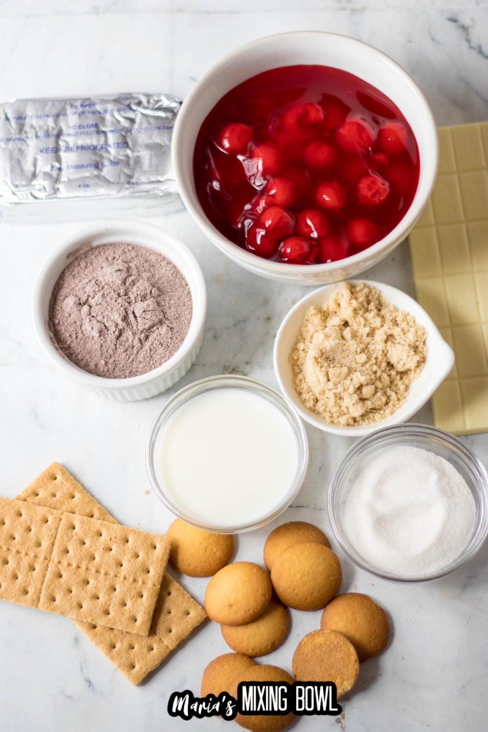 cream cheese, cherry pie filling, chocolate pudding mix, sugar, graham crackers, nilla wafers, and white chocolate ingredients