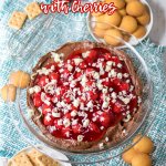 chocolate cheesecake dip with cherries on top with the name in text for pinterest