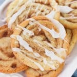 stack of cinnamon bun cookies on a white plate
