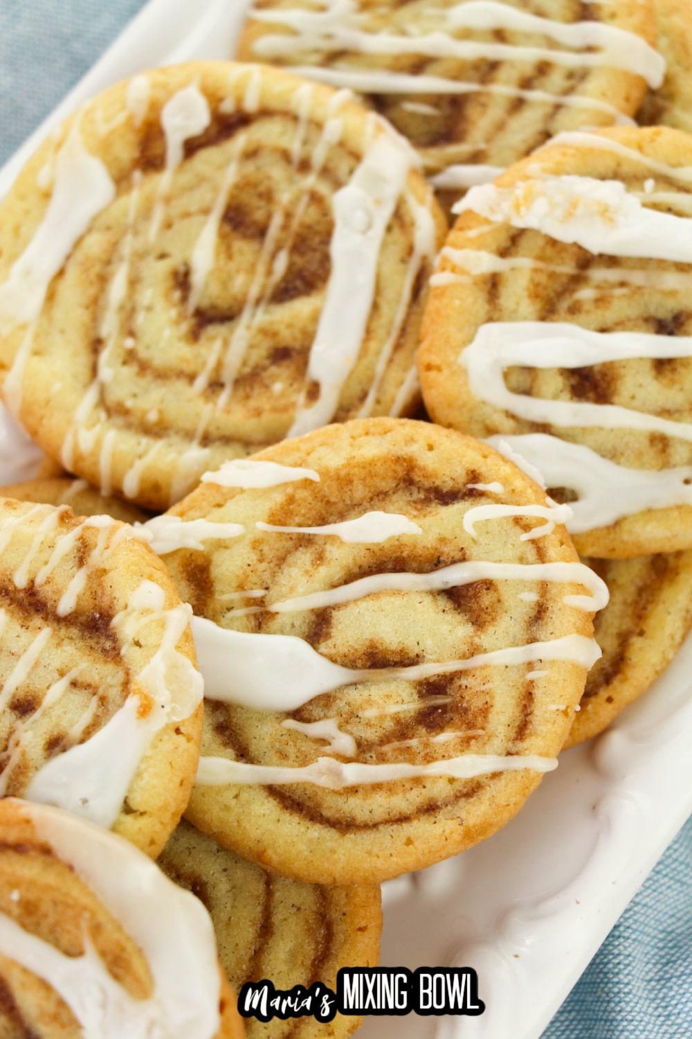 stack of cinnamon bun cookies on a white plate