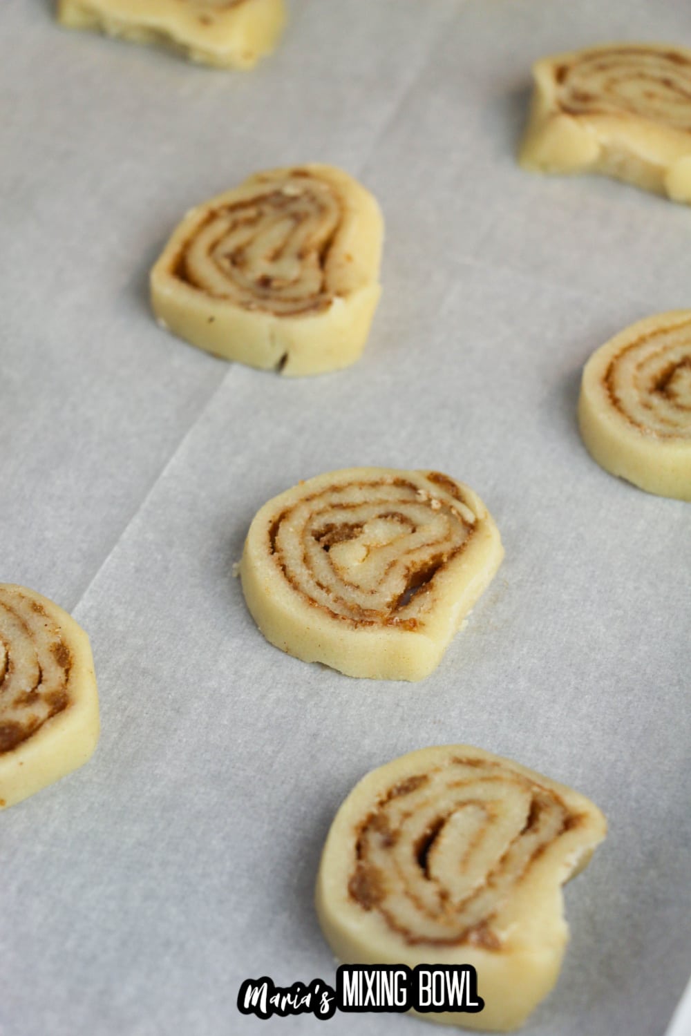 cookie dough sliced on a parchment lined baking sheet