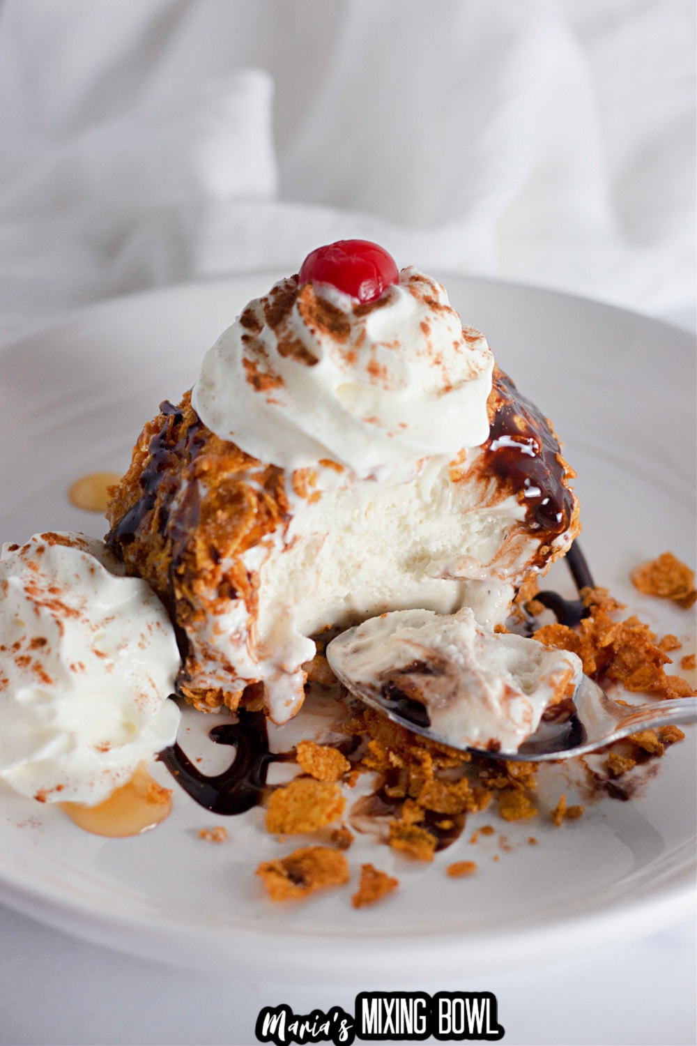 close up of a ball of ice cream with the a couple bites missing
