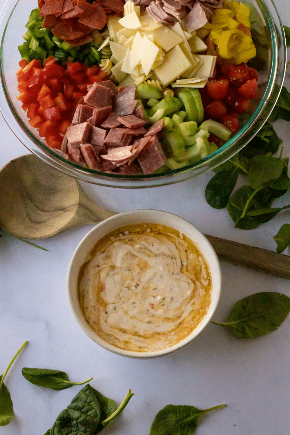 dressing being made in small white mixing bowl