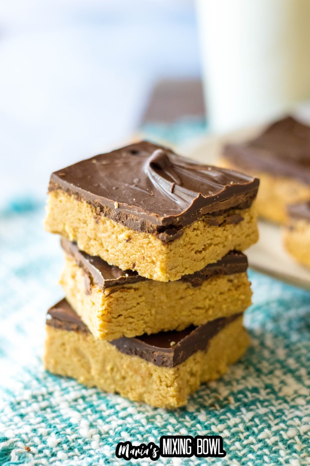 stack of three lunch lady peanut butter bars on a green and white napkin