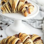 nutella crescent rolls on a white cake stand