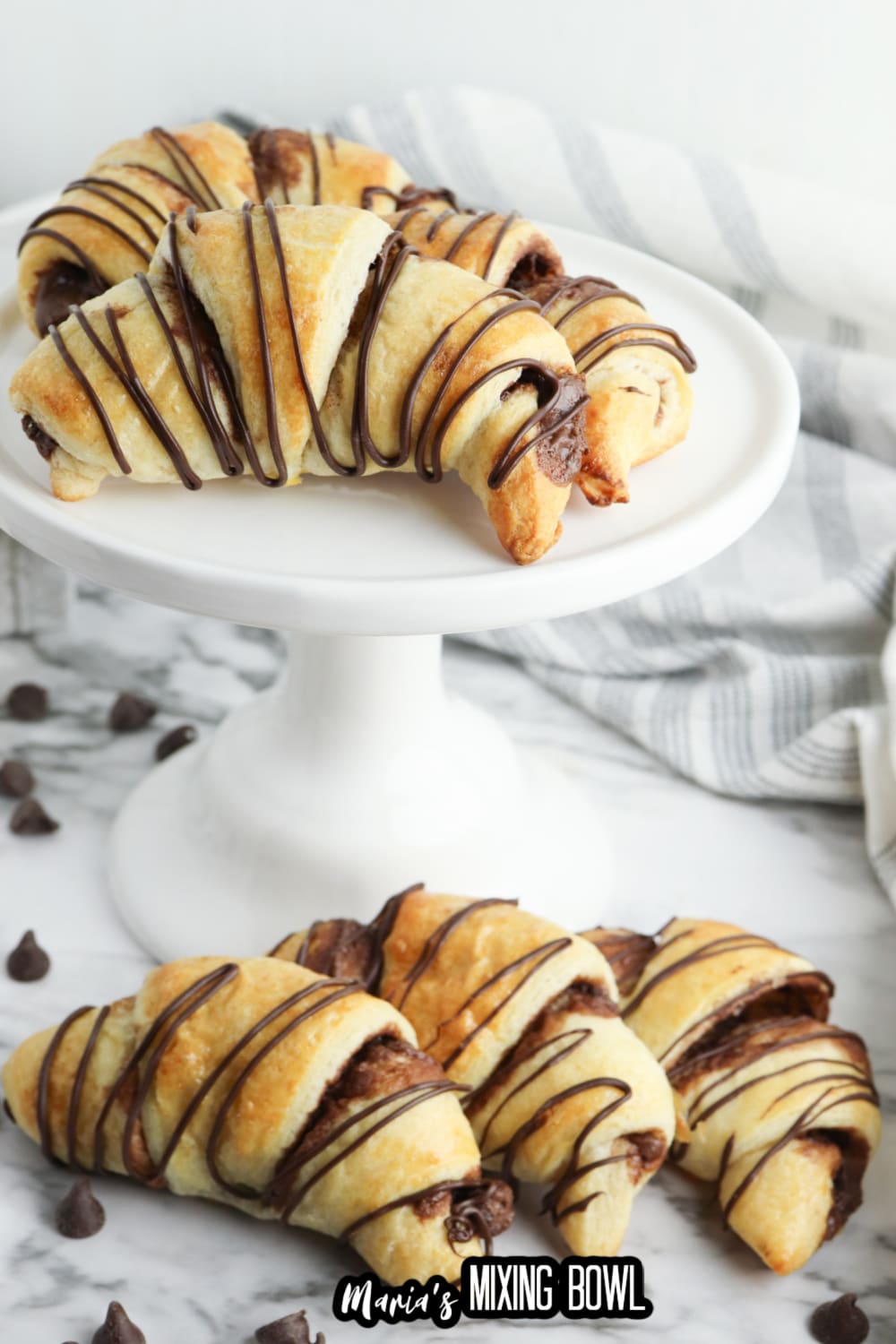 nutella crescent rolls on a white cake stand