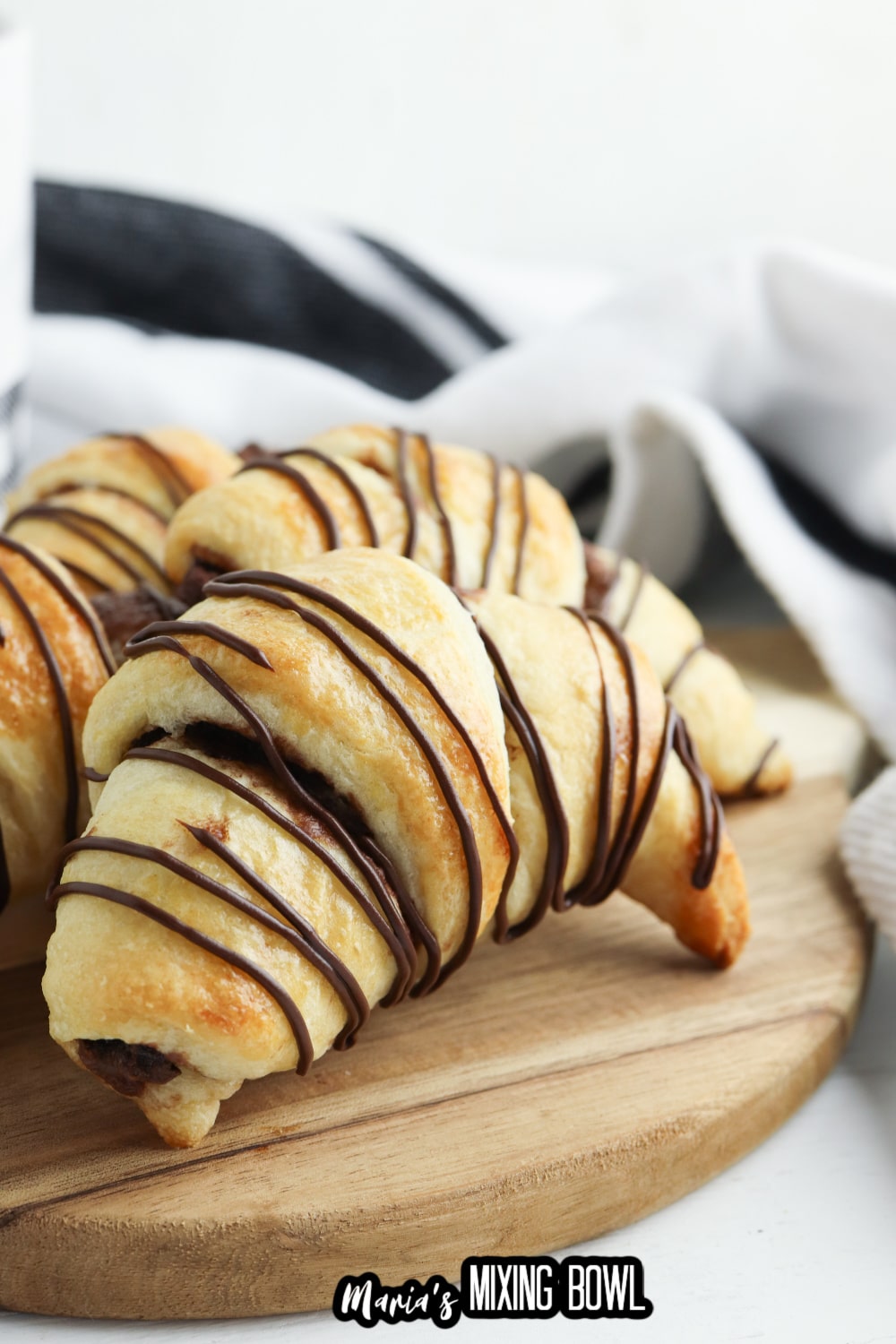 nutella crescent rolls on a wooden cutting board