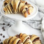 nutella crescent rolls on a white cake stand