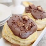 two reeses stuffed donuts on a white plate