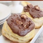two reeses stuffed donuts on a white plate with the name in text for pinterest