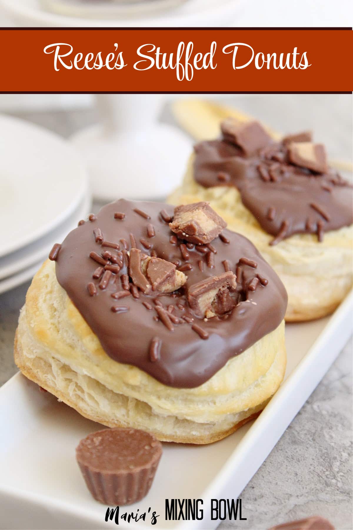 two reeses stuffed donuts on a white plate with the name in text for pinterest