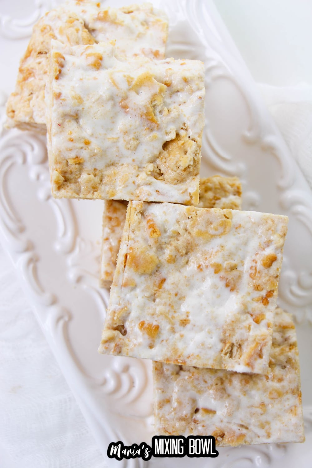 cut ritz cracker treats stacked on a white plate