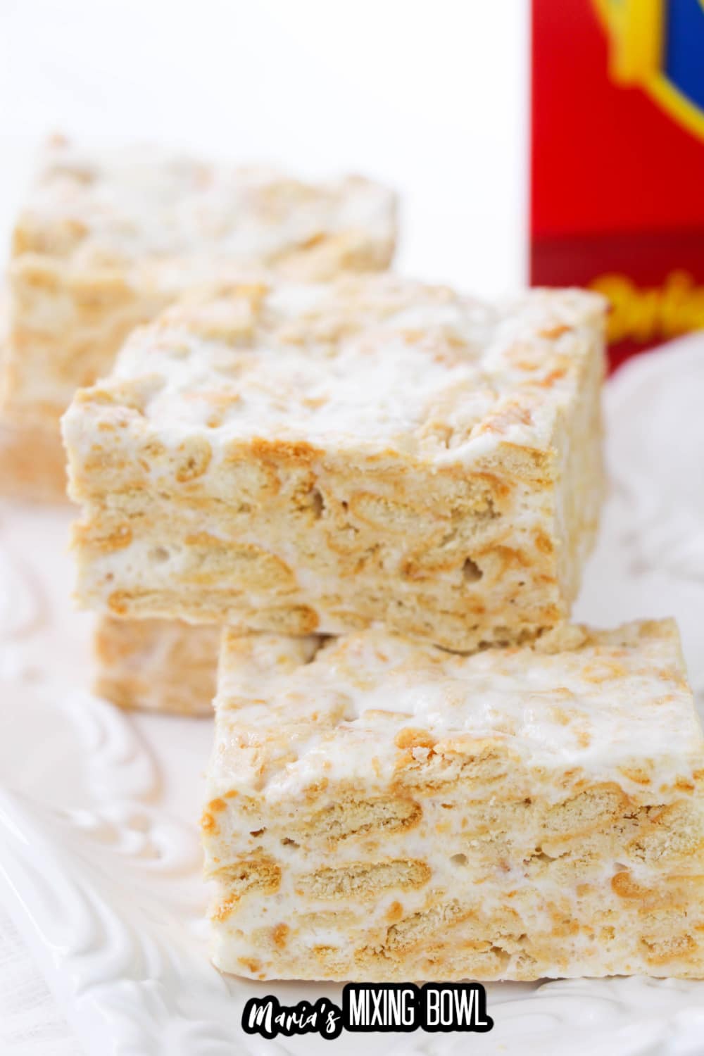 cut ritz cracker treats stacked on a white plate
