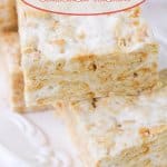 cut ritz cracker treats stacked on a white plate with the name in text for pinterest