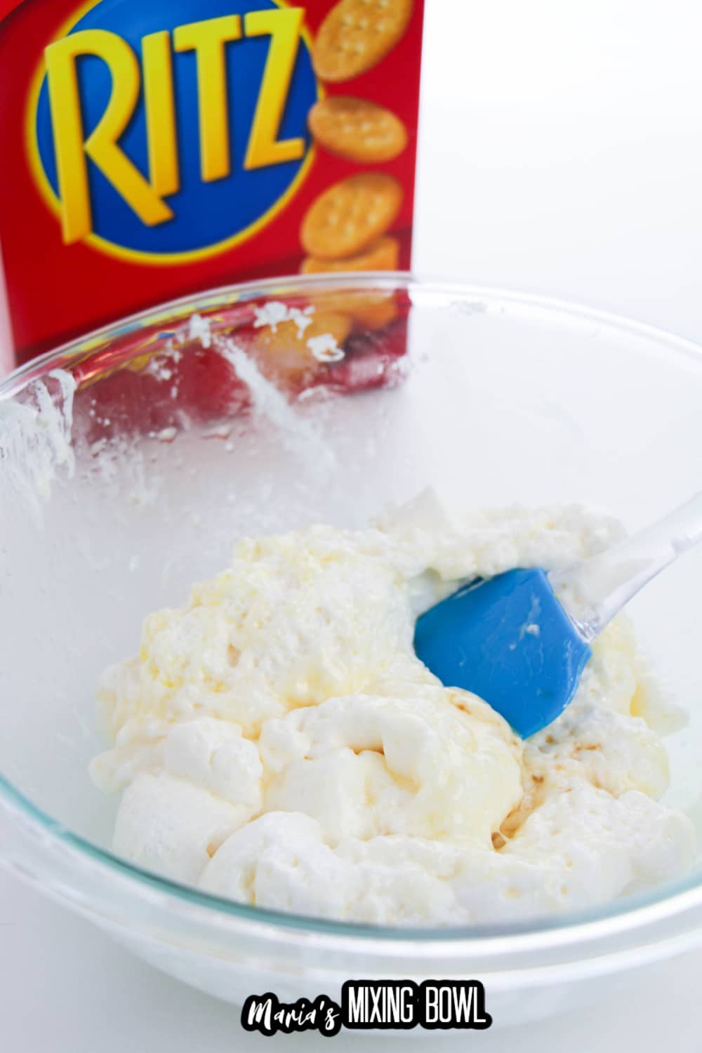 marshmallows and butter being melted in a glass mixing bowl