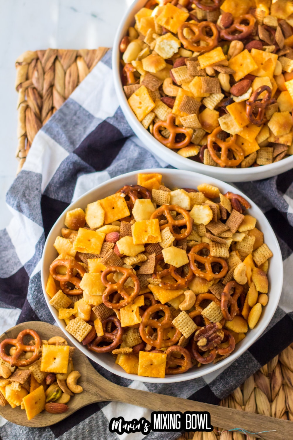 chex mix in two large white bowls