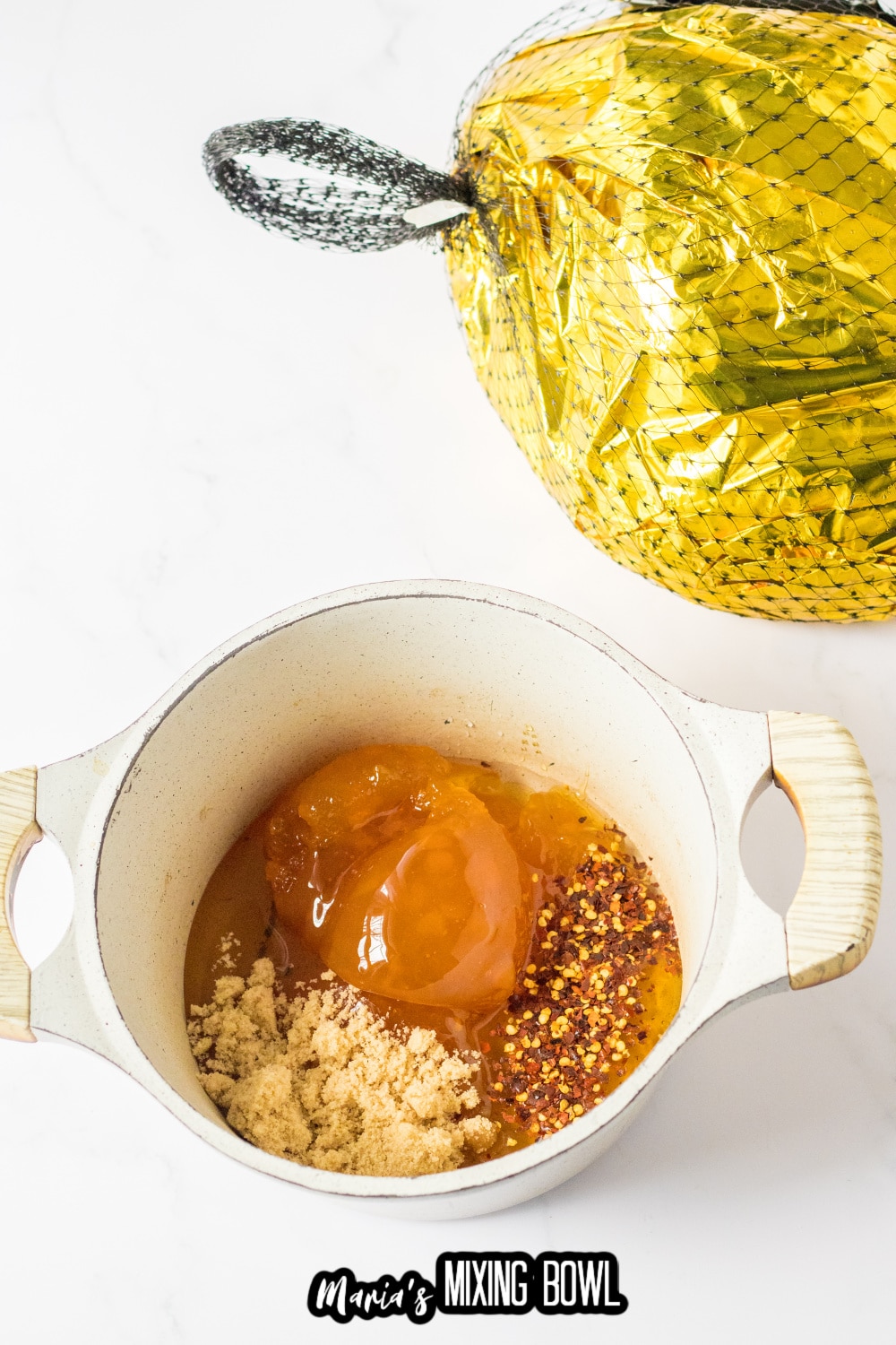 honey, red pepper flakes, and peach preserves in a small saucepan