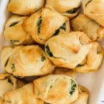 spinach cheese crescent rolls on a white platter