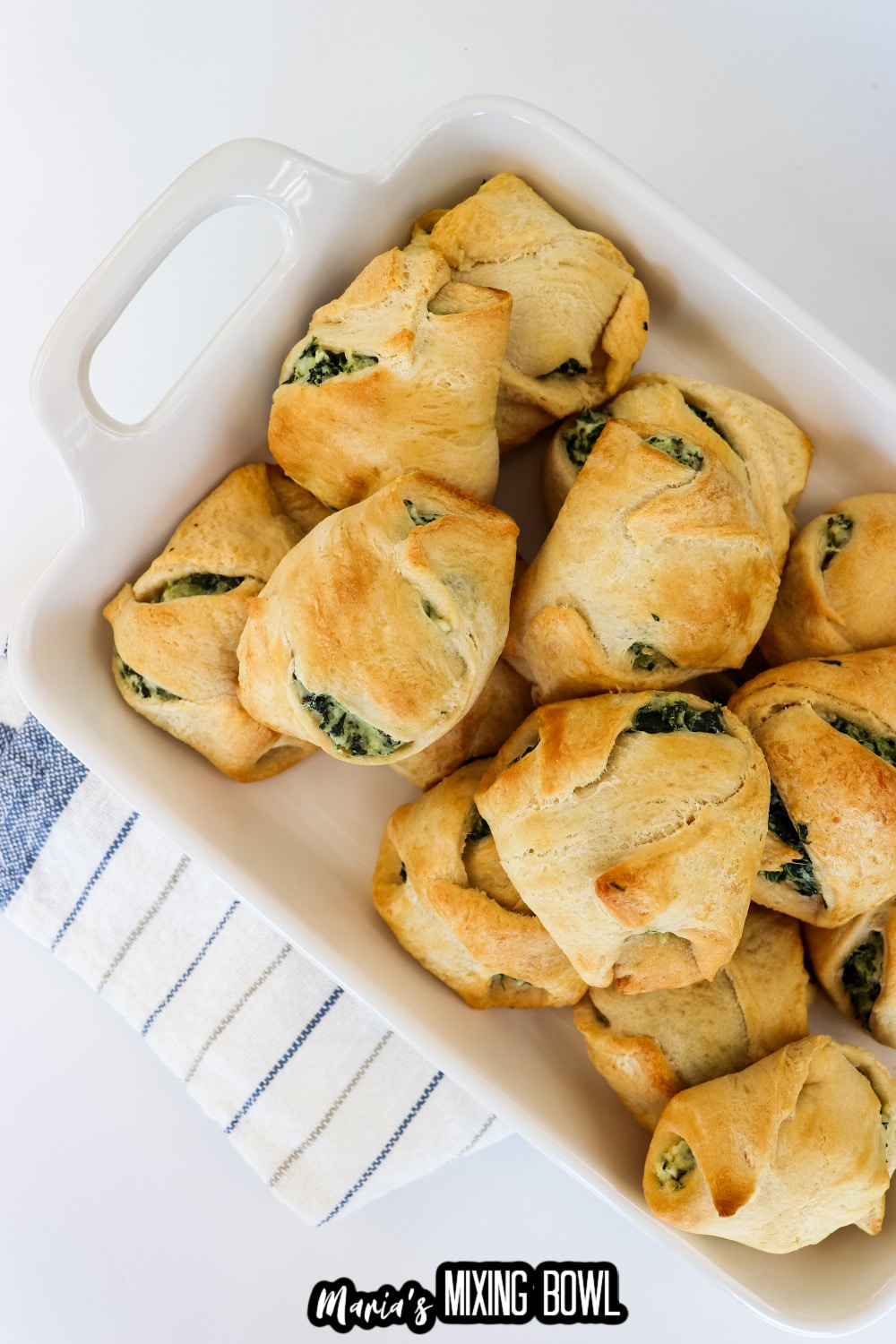 spinach cheese crescent rolls on a white platter