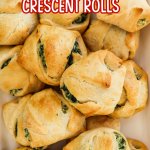 spinach cheese crescent rolls on a white platter with the name in text for pinterest