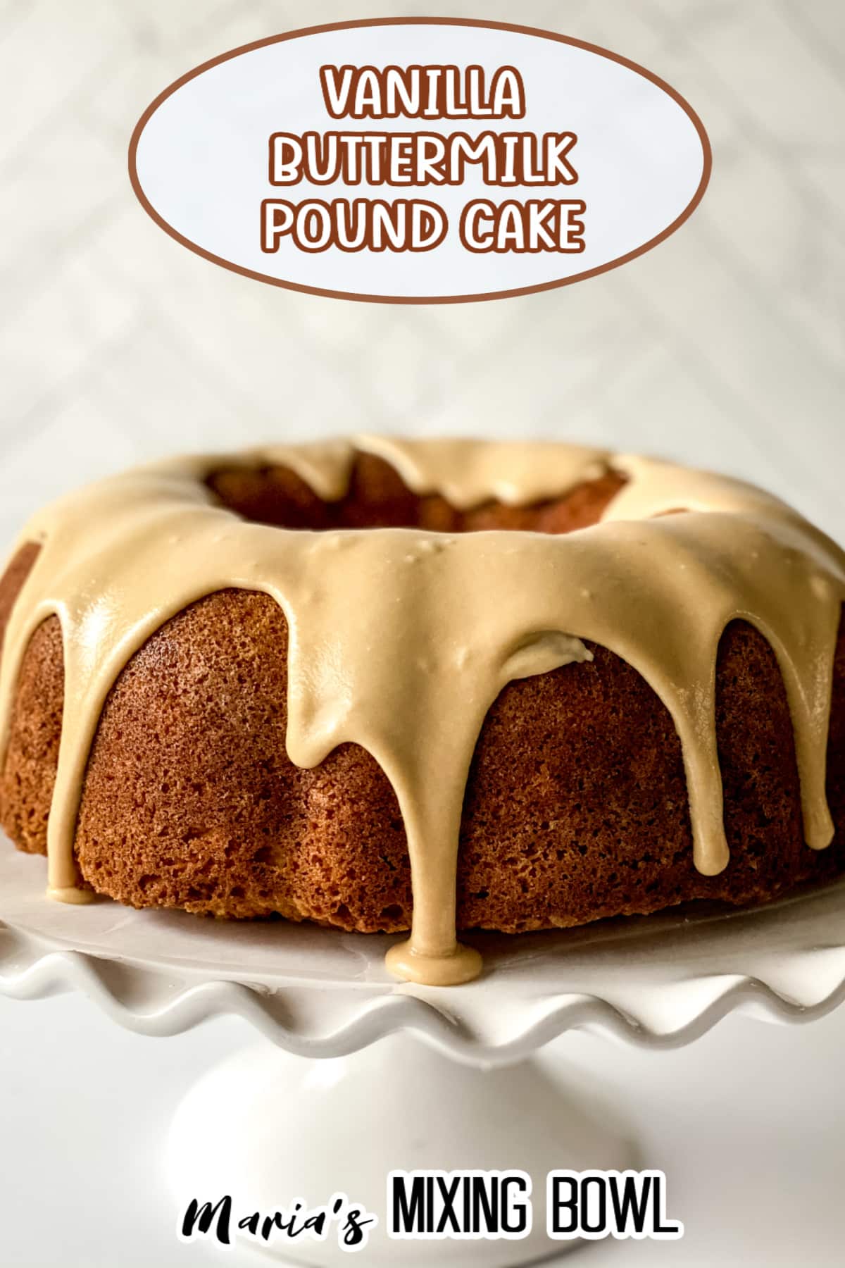 uncut buttermilk pound cake on a white cake stand with the name in text