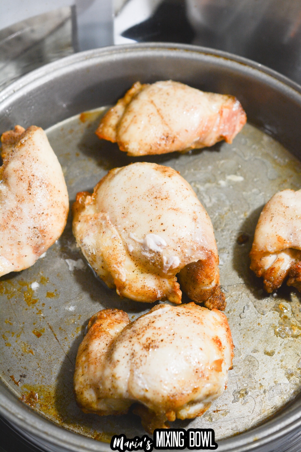 chicken thighs cooked in a round cake pan