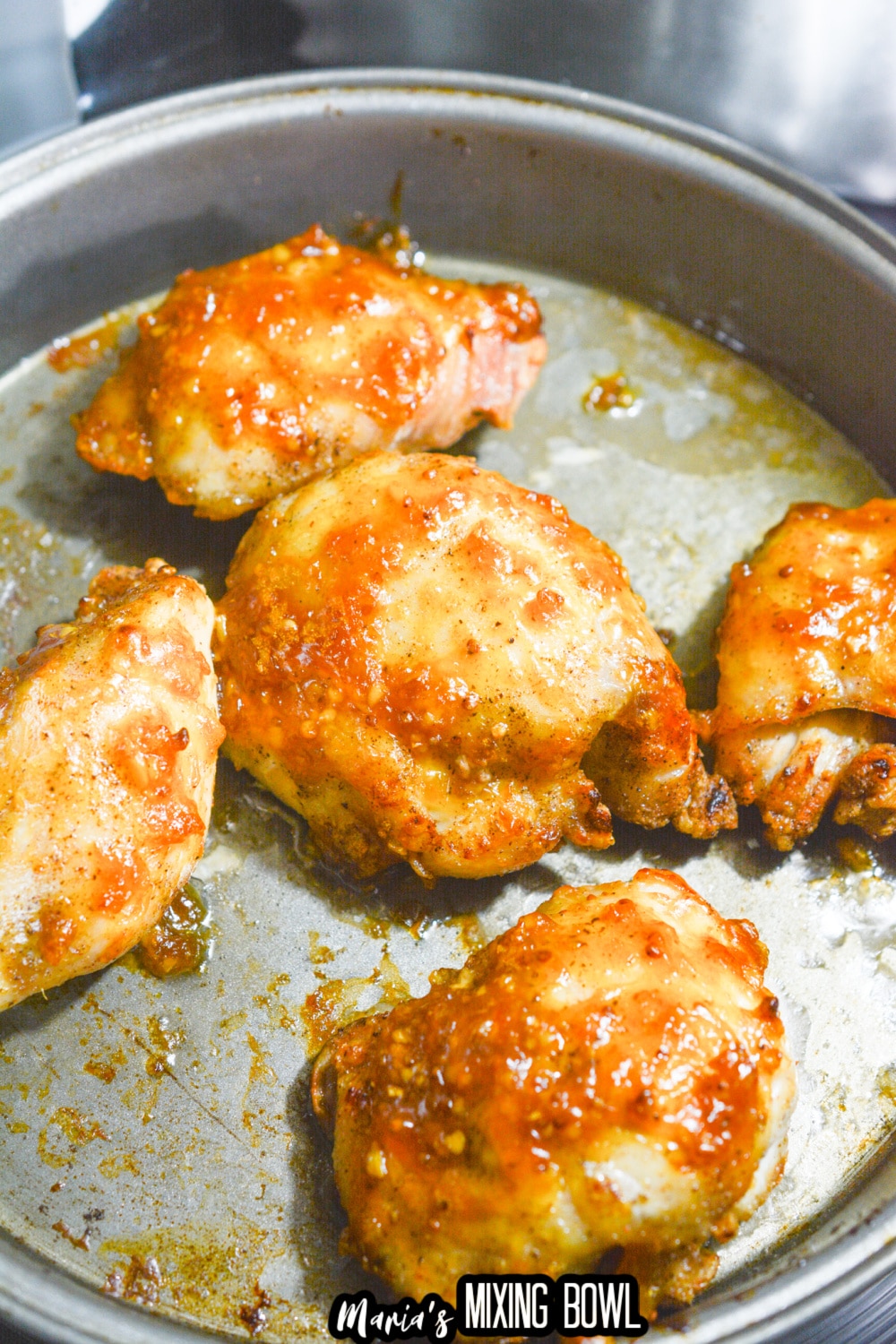 glazed chicken thighs in a cake pan