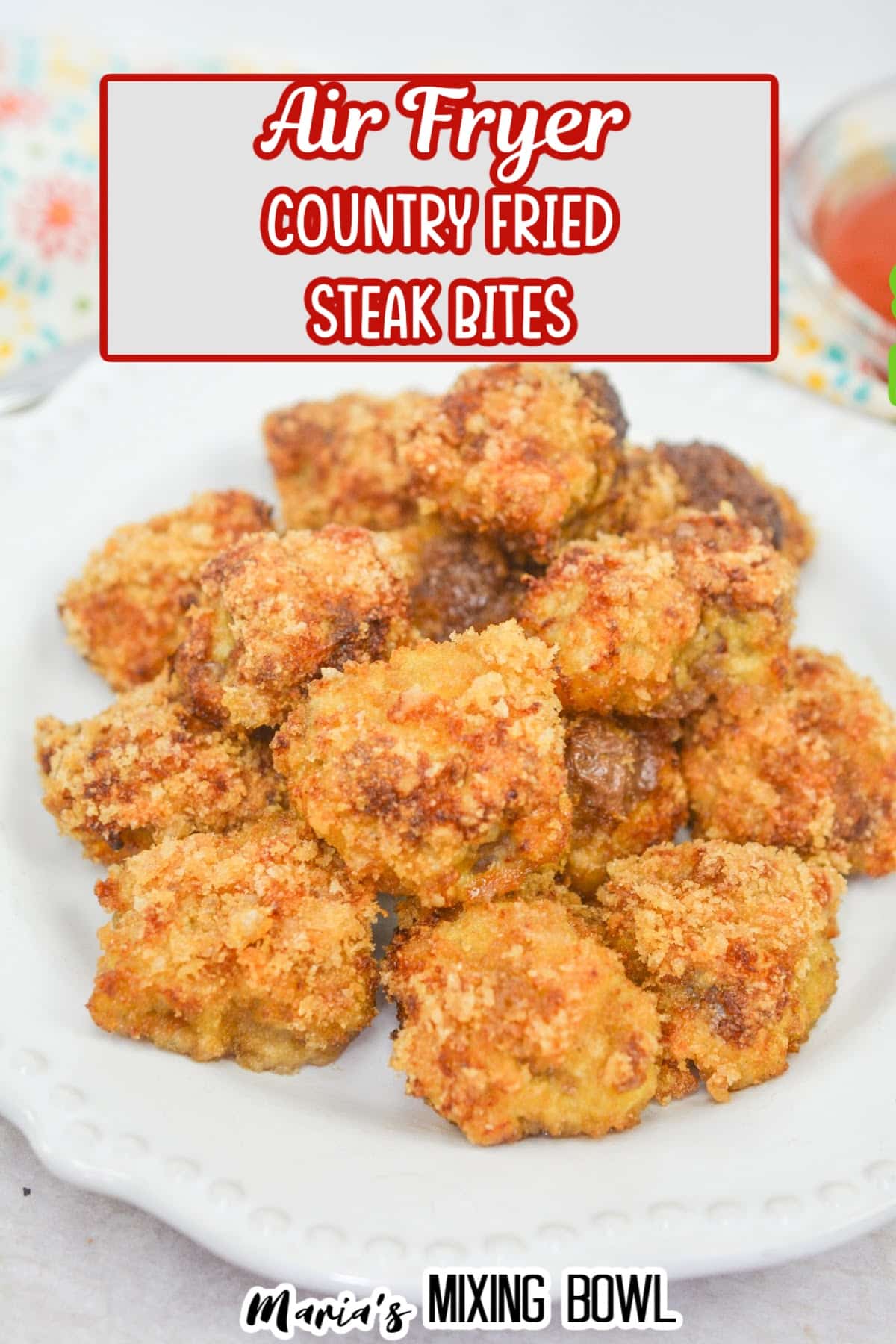 stack of country fried steak bites on a white plate