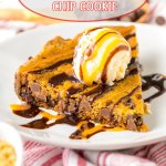 slice of cookie cake on a white plate topped with a scoop of vanilla ice cream and caramel and chocolate drizzle
