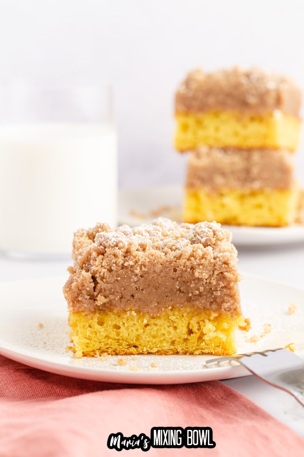 slice of double crumb cake on a white plate