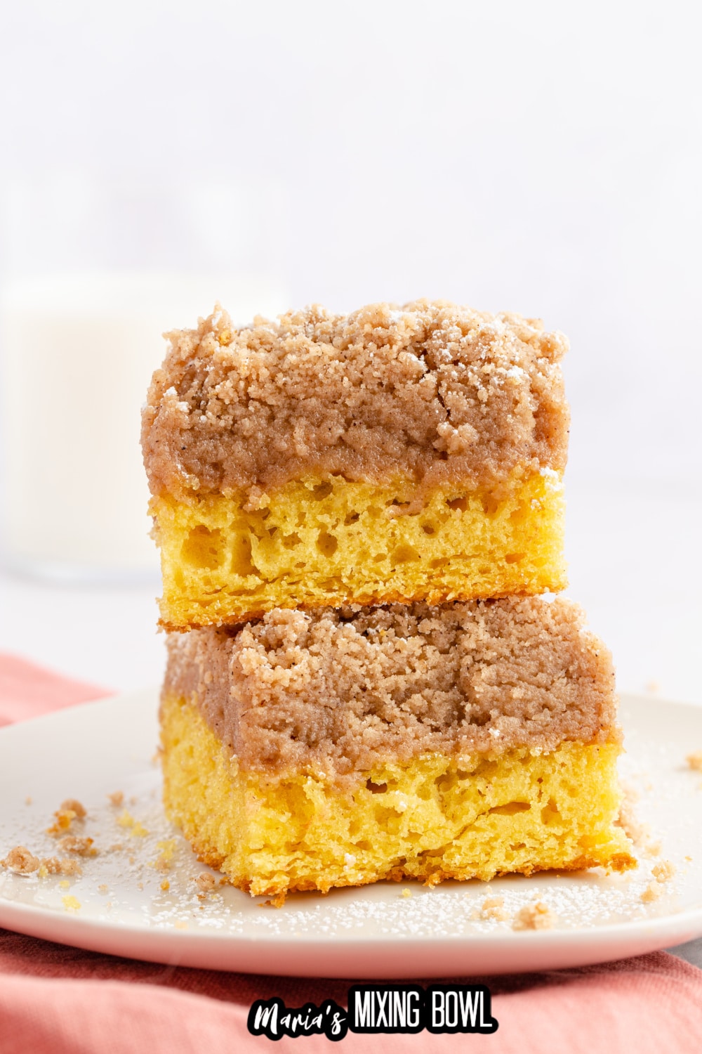 two slices of double crumb cake staked on top of each other on a white plate