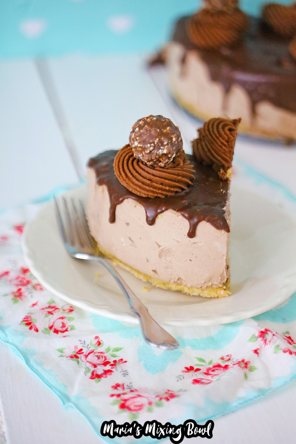 slice of ferrero roche cheesecake on a small white saucer