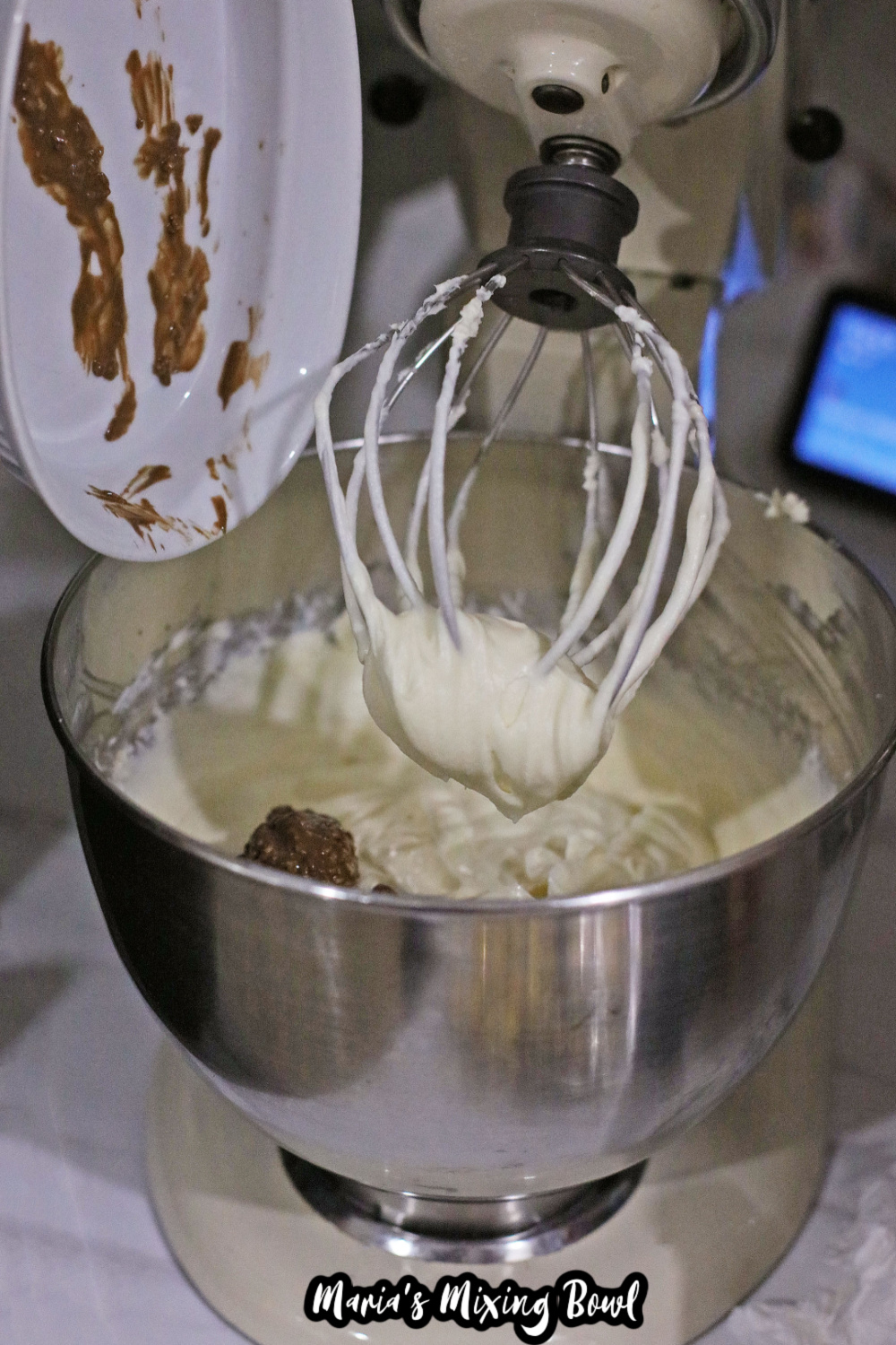 cream cheese and sugar, and nutella in a stand mixer