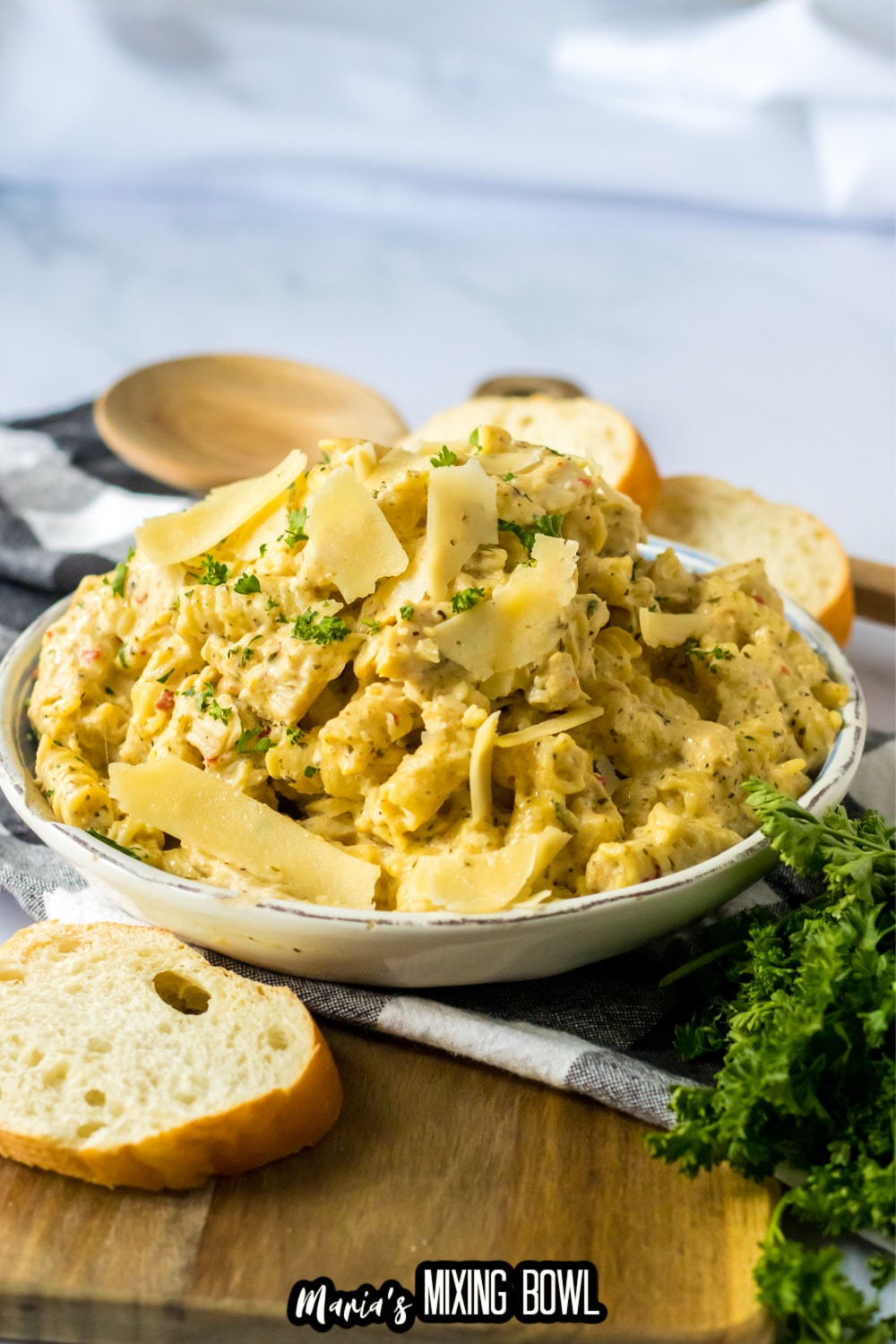 bowl of garlic parmesan chicken pasta on a white bowl