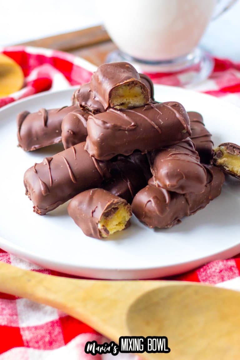 homemade twix bars stacked on a white plate