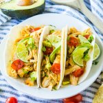 three honey lime chicken tacos on a white plate