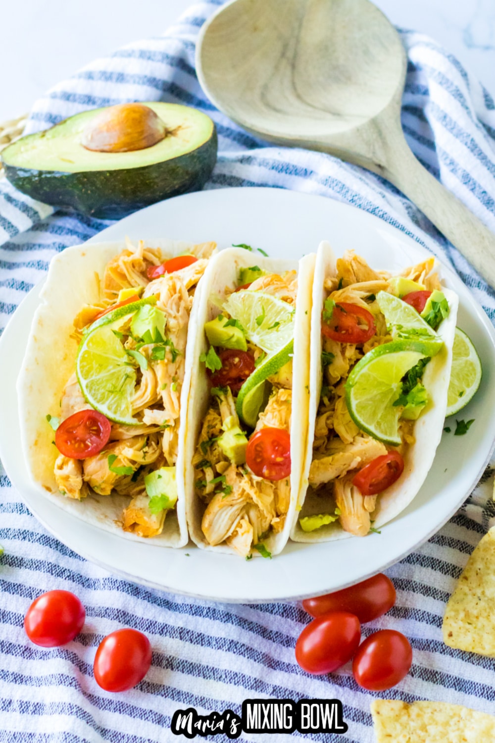 three honey lime chicken tacos on a white plate