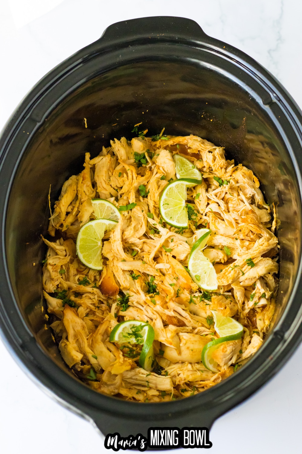 cooked chicken topped with lime wedges